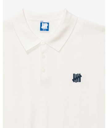 UNDEFEATED S/S KNIT POLO est présent 